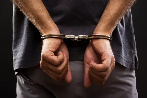 depositphotos_28098513-stock-photo-close-up-arrested-man-handcuffed (1)