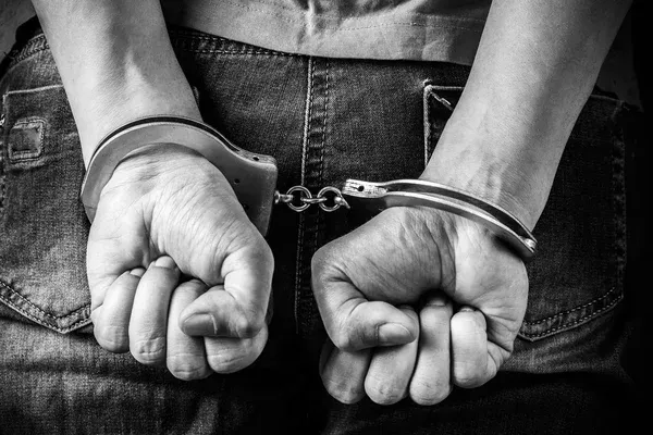 depositphotos_71721007-stock-photo-male-hands-in-handcuffs