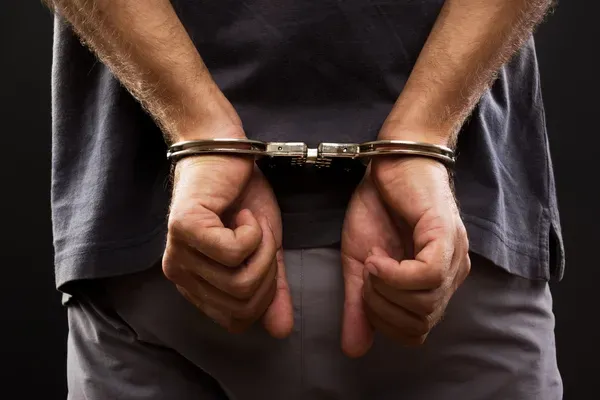 depositphotos_28098513-stock-photo-close-up-arrested-man-handcuffed (2)